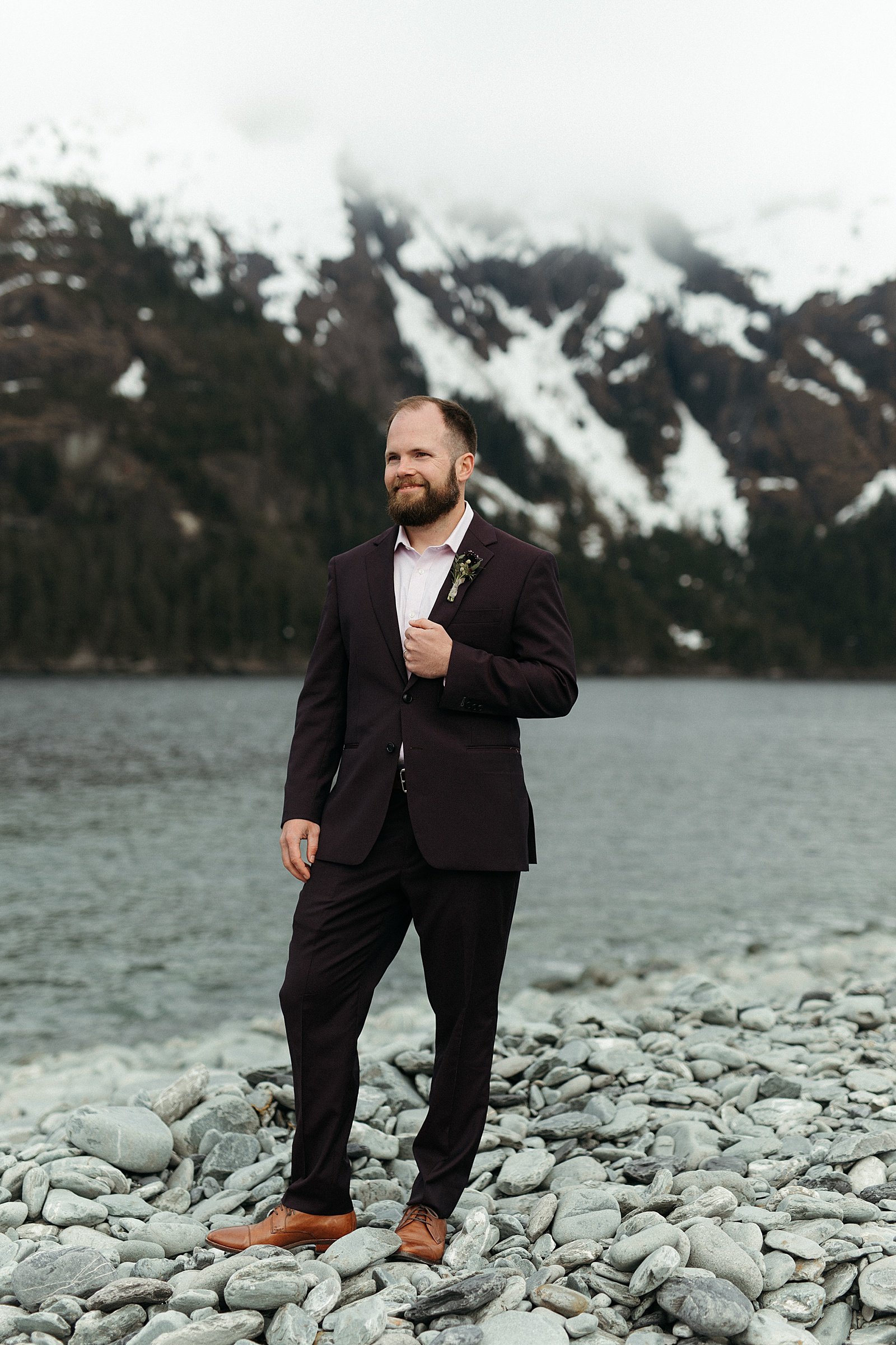 Groom in front of mountain at Seward adventure elopement 