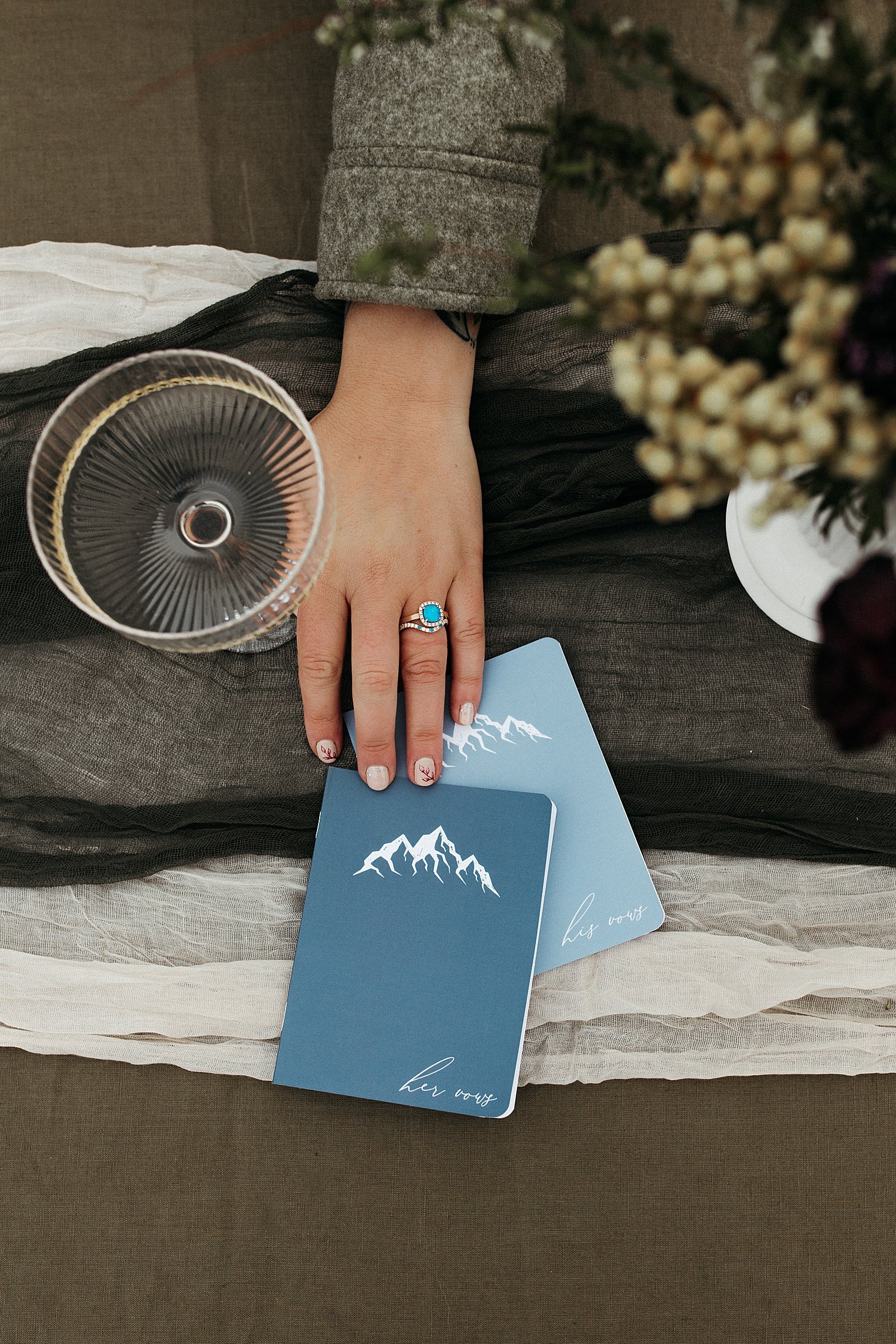  Bride holding onto pamphlets at private picnic by Rachel Struve Photography 