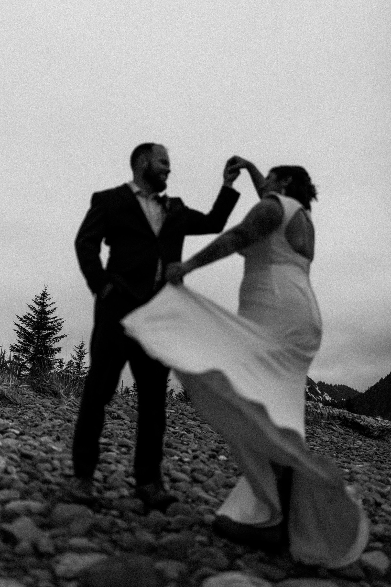  Newlyweds dancing after their wedding ceremony by an Alaska wedding photographer 