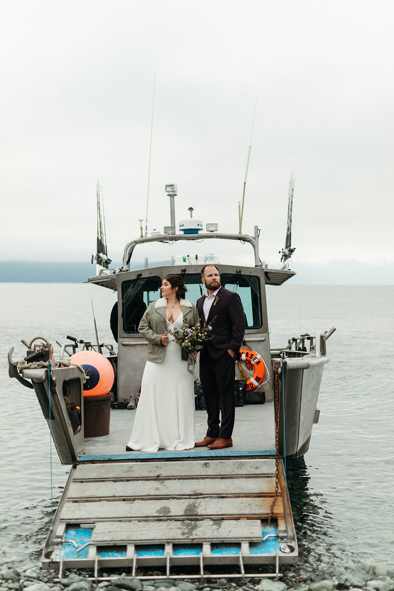  Newlyweds on a boat after their Seward adventure elopement 