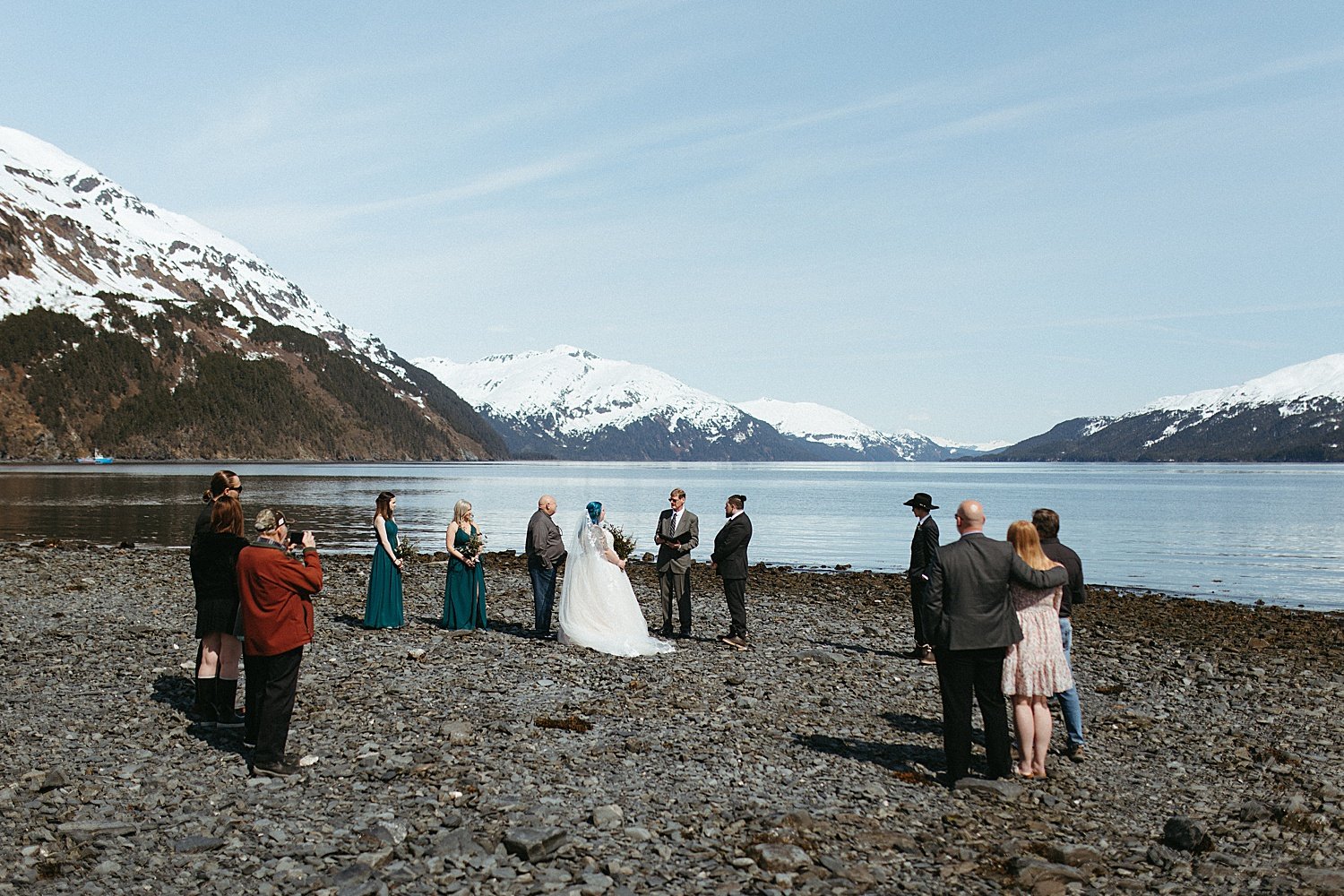  A small ceremony on the water with mountains in the background  by Alaska Elopement Photographer 