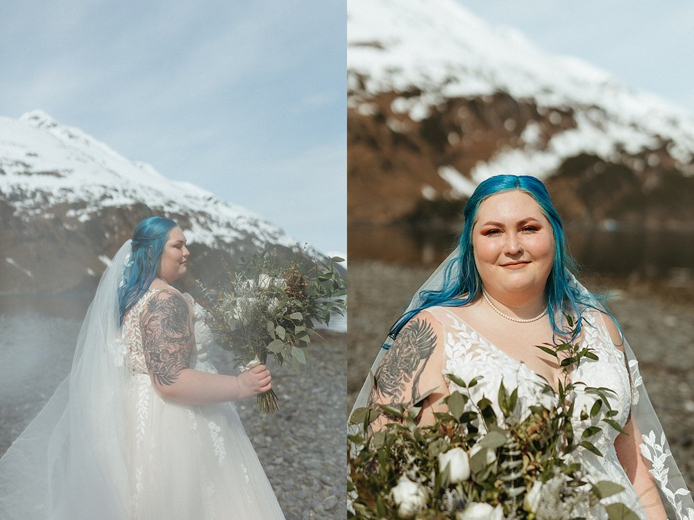  Bride with blue hair holding flowers next to the water by Rachel Struve Photography in Alaska 