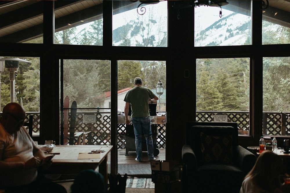  Guests gathered in a an Airbnb for an intimate beach elopement in Girdwood 
