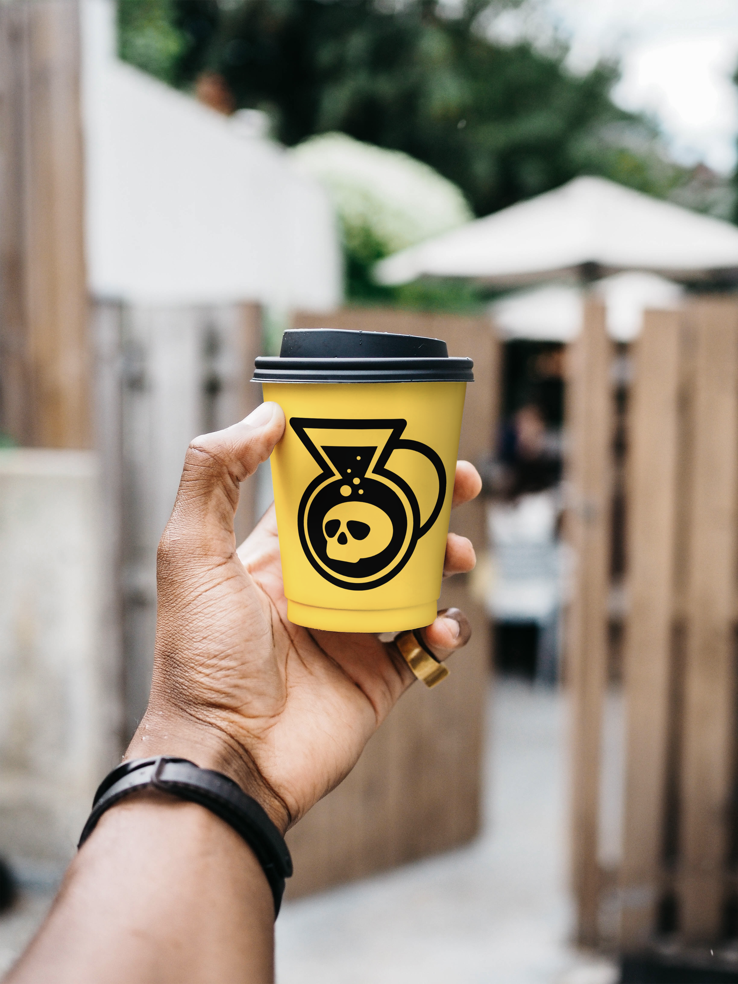Cup Mockup with Hand.png