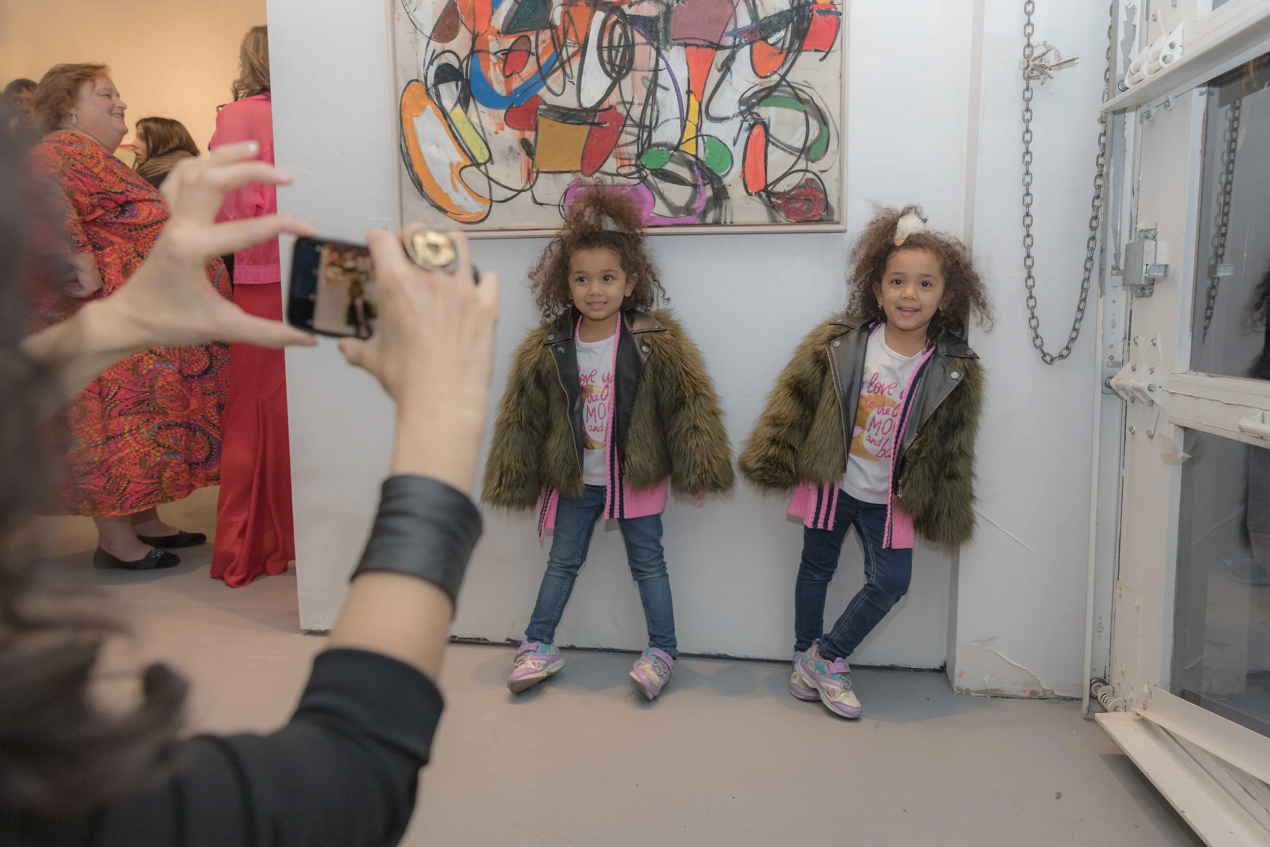 Twinning next to their favorite piece by Taher Jaoui