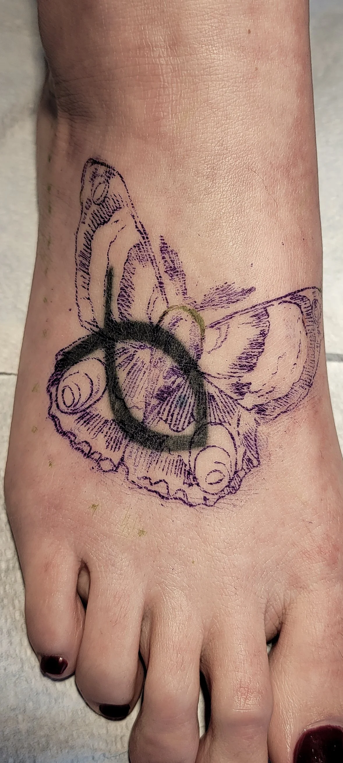 Before cover up of a jesus fish on foot that I plan on covering with a moth.