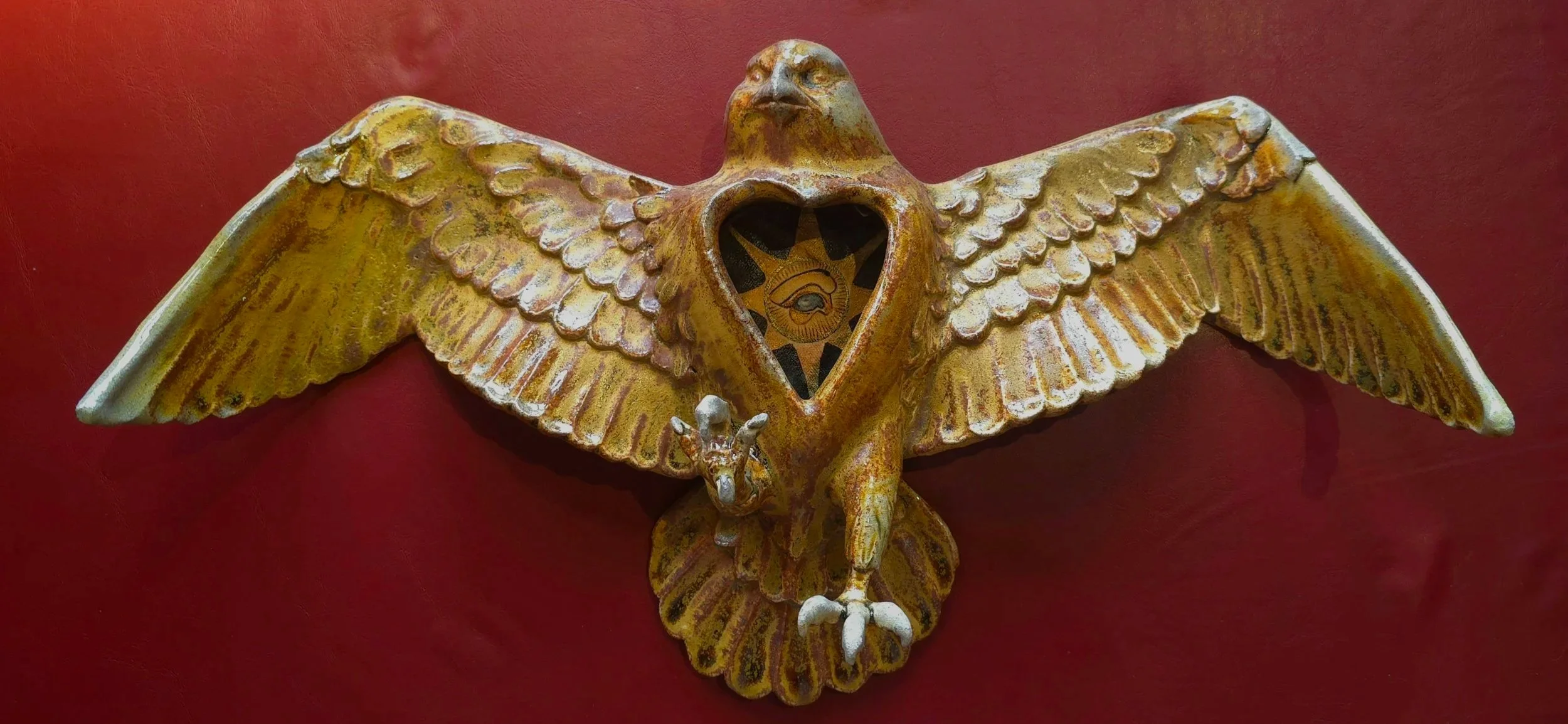 14"X10" Mysticus 2025 

Ceramic bird wall hanging sculpture color created through a soda fire process with Acrylic on canvas painting in the belly of a eye in a sun, in a medieval styling.  
