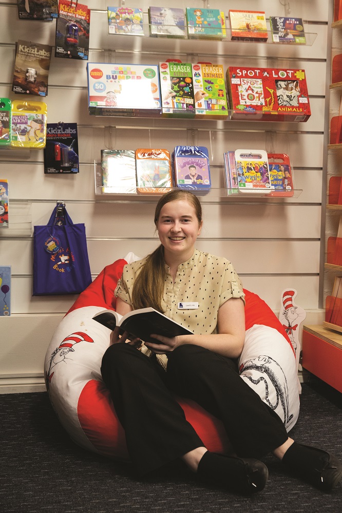 Trainee Caitlyn Keene taking a moment to read in a quiet spot.jpg