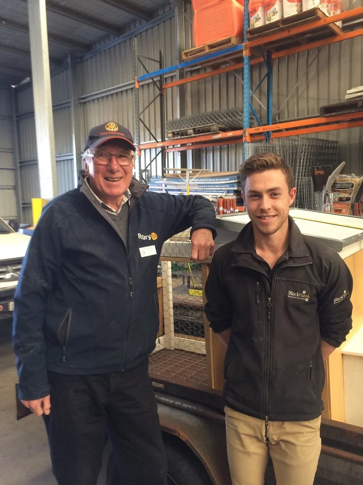 3.John Templeman presenting the chook tractor he helped design and build to the lucky winner of our raffle.jpg