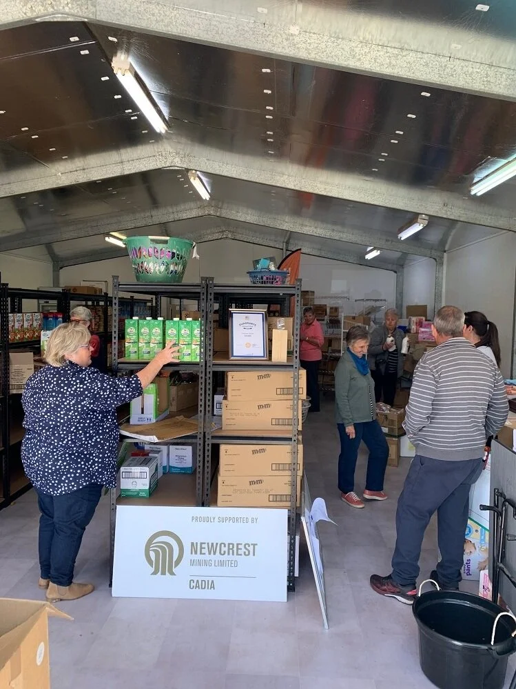 FoodCare Volunteers Getting the new shop ready.jpg