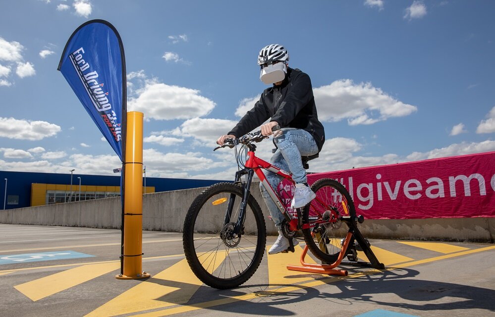 VR headset with cyclist simulation at Ford's Driving Skills for Life 2019 launch.jpg
