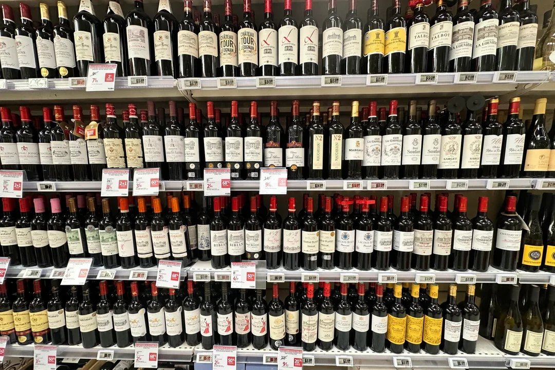 Wine aisle showing wall of bottles illustrating the challenge of wine label copy
