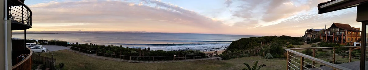Jeffreys Bay, South Africa . This view from our balcony of and the best right hand point break in the world. When supertubes fires there is no place on earth that delivers such quality waves.