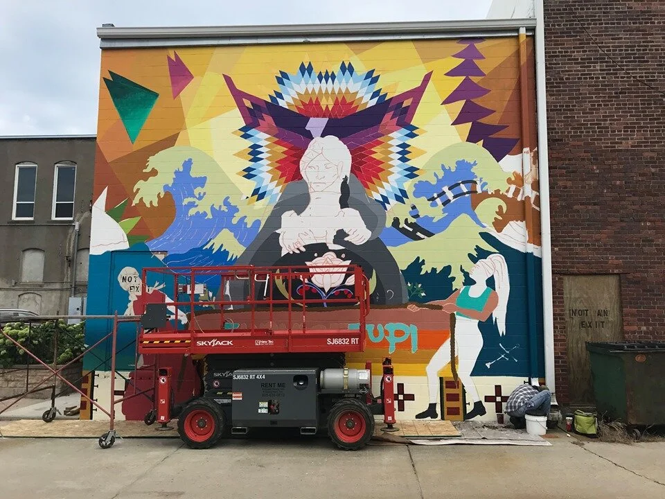 After weeks of work by the lead muralists and assistant artists during hot summer evenings, the mural is looking vibrant and ready for detailing.
