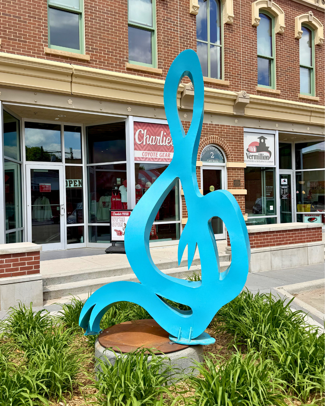 The Beginning, by Rachel Heine. 
Located at the corner of Center & Main Streets.