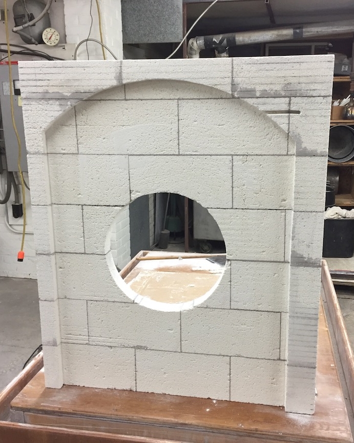 Carved brick glory hole front