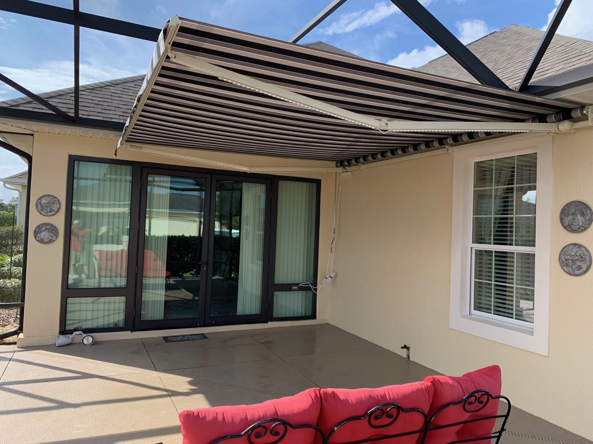 Retractable Awning rising above birdcage covers — Retractable Awnings