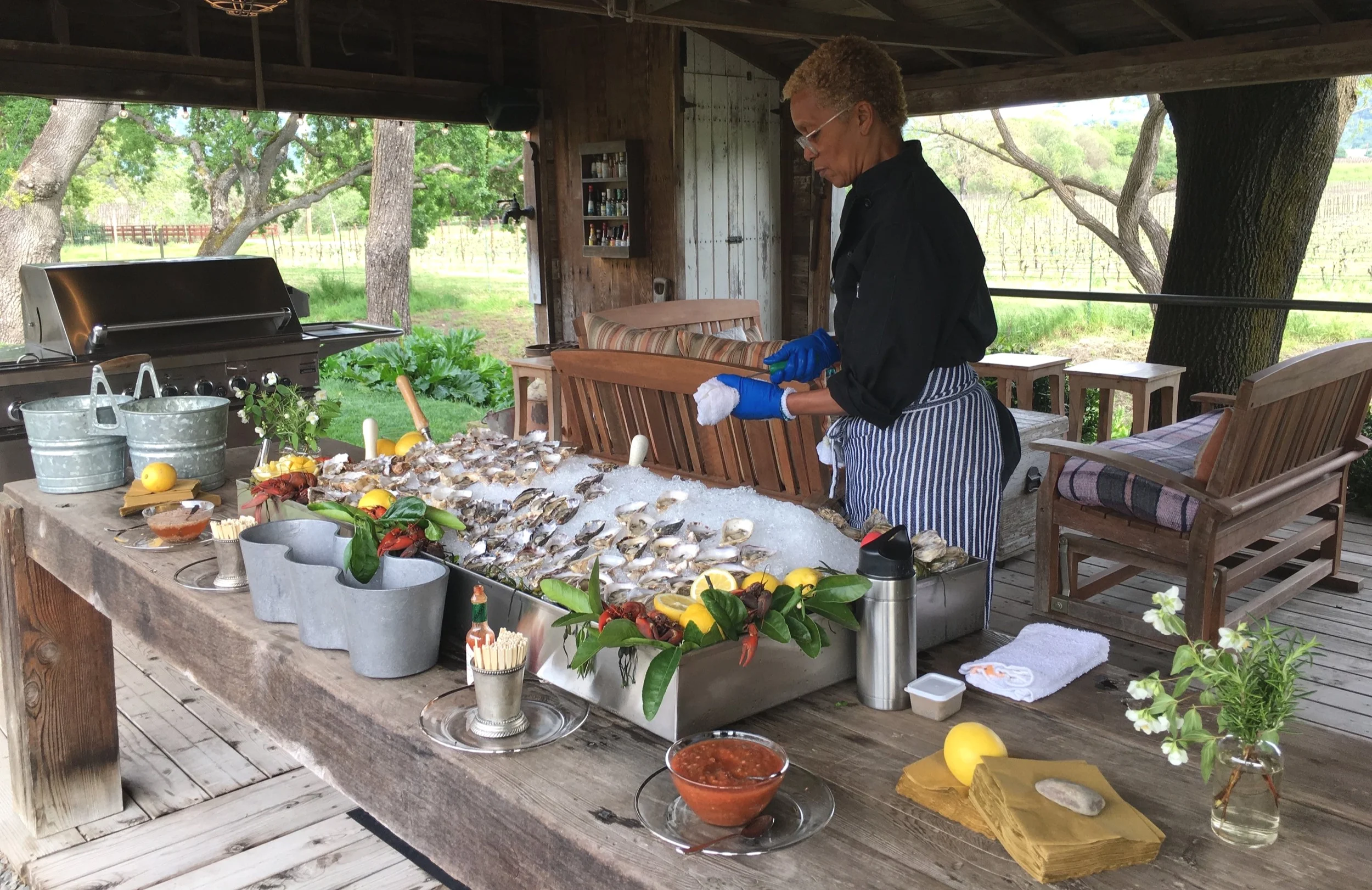 Renée puts the finishing touches on an oyster bar for a Wine Country garden party
