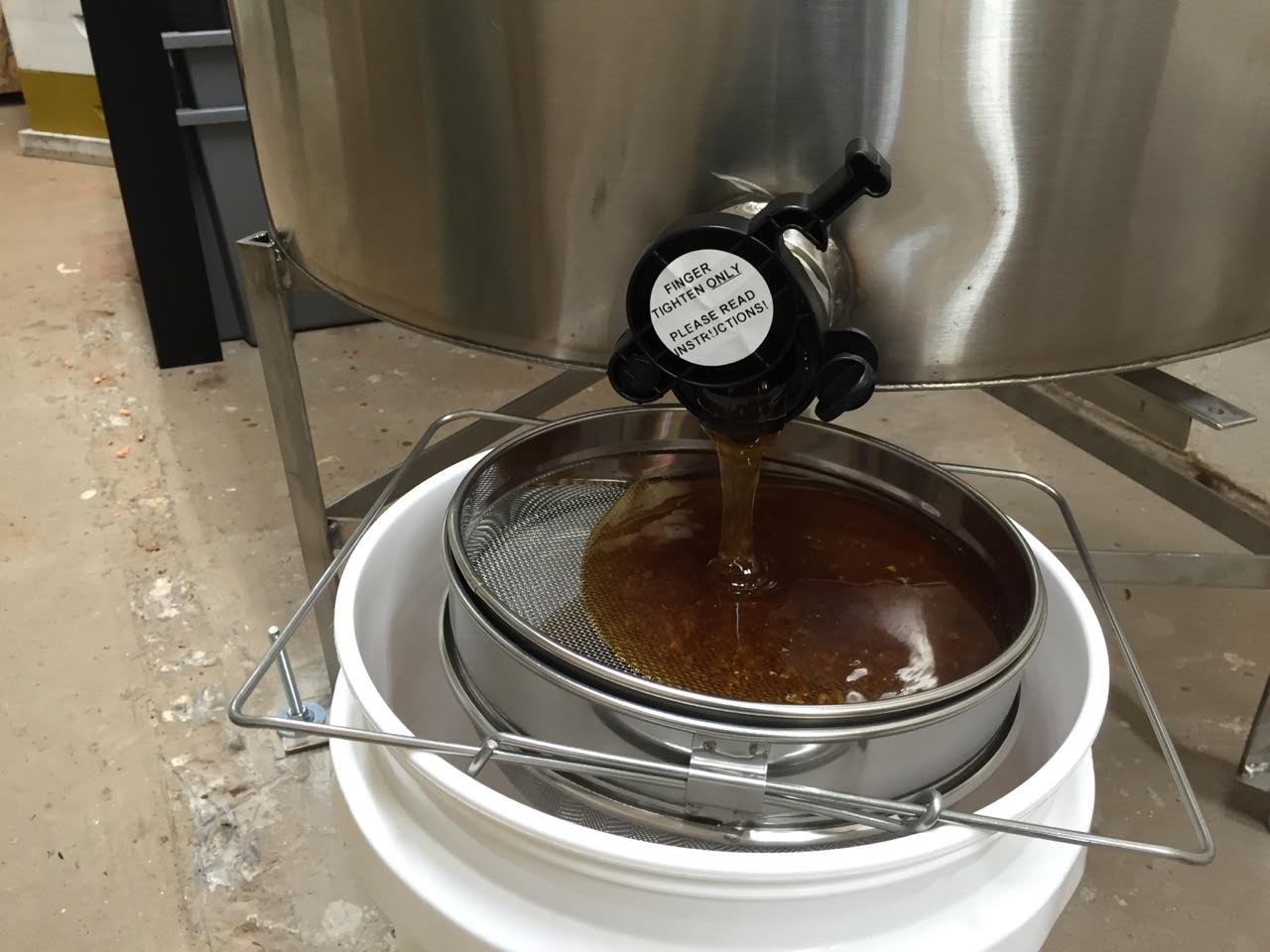 Honey being extracted in the new extraction facility.