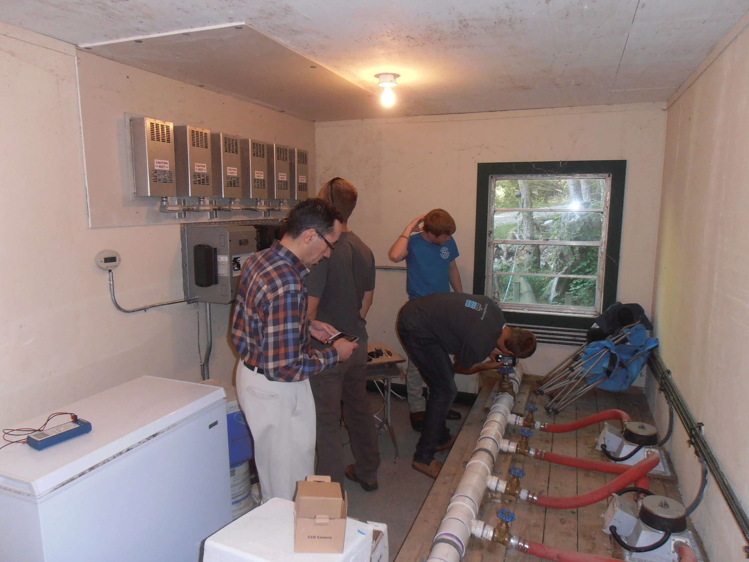 Students from Western Carolina University working diligently on their hydroelectric capstone project at Everett Williams’ trout farm.