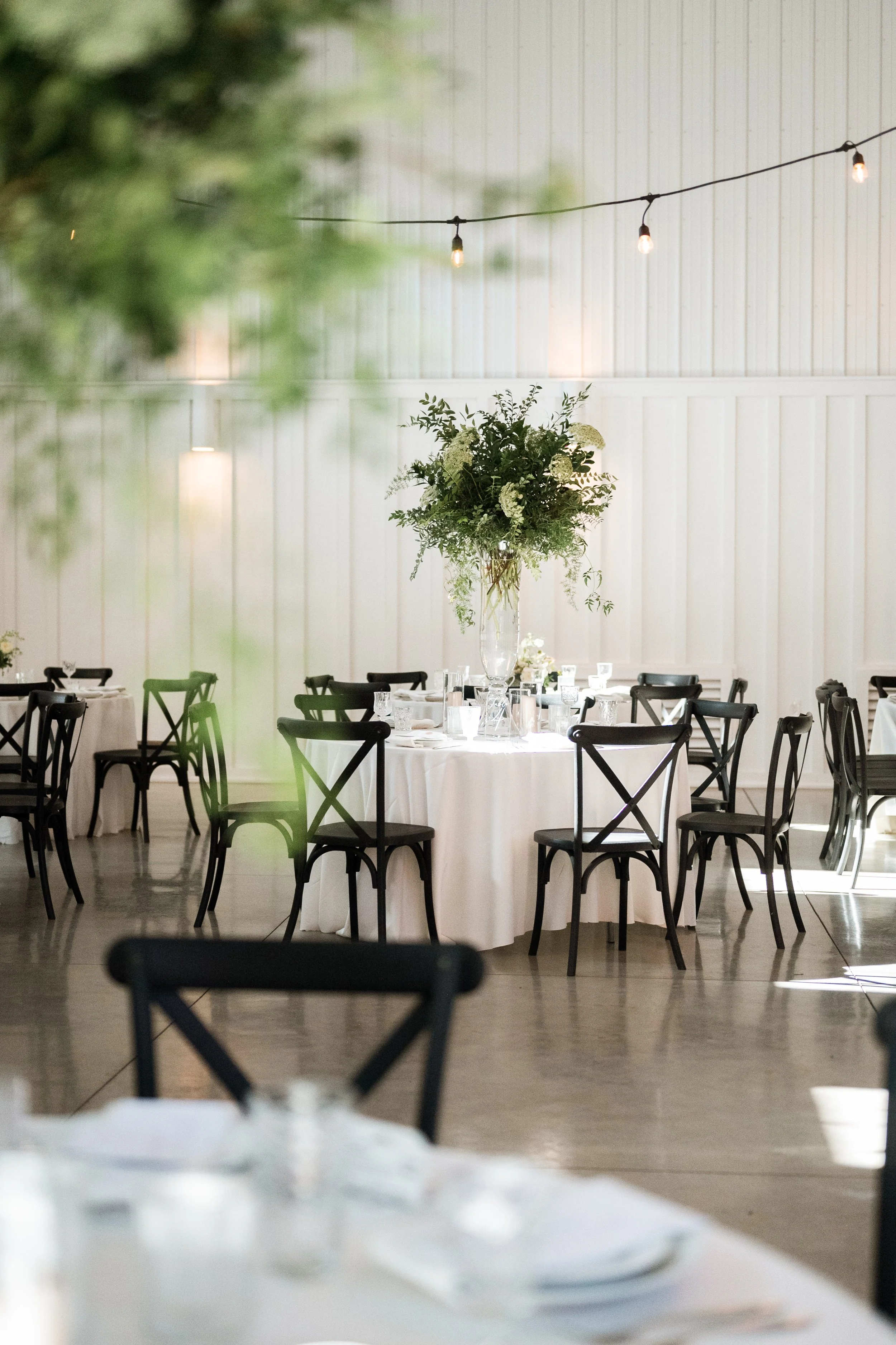Wedding reception tables and linens set inside Cliffside Acres in Springfield, Ohio
