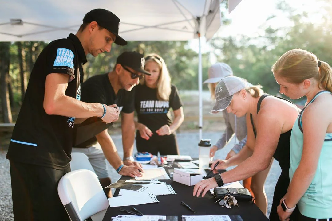 Volunteers helping register runners the morning of the run. All in all, 42 runners from across the panhandle braved the woods to take their shot at outrunning the bear for freedom!