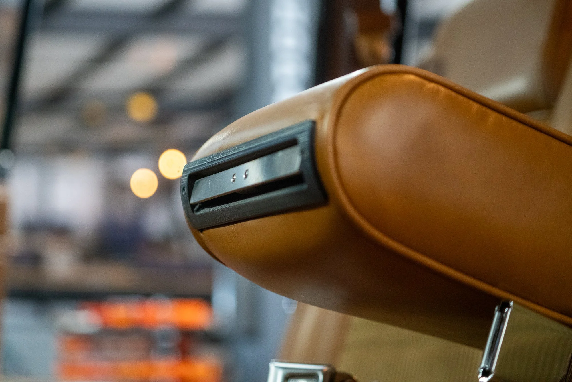 Full-size Jeep armrest console with hidden cup holder closed