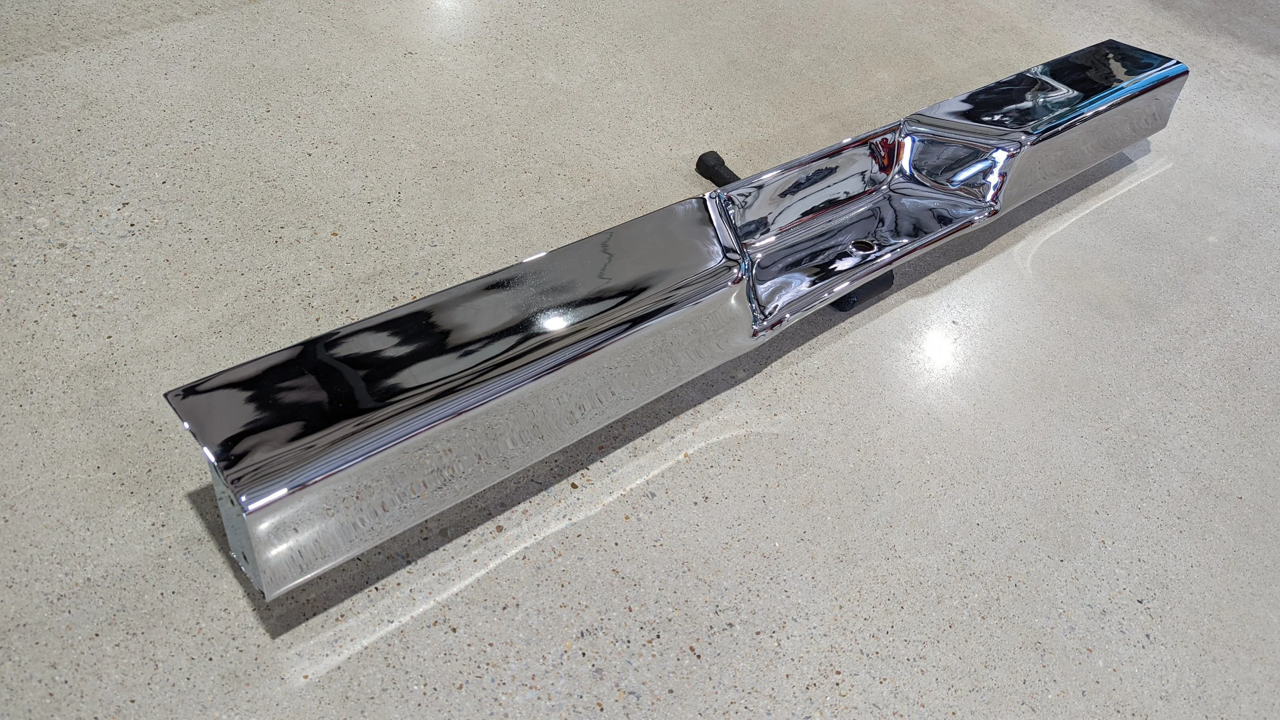 Detail shot of chrome-plated rear bumper for Jeep J-Truck restoration