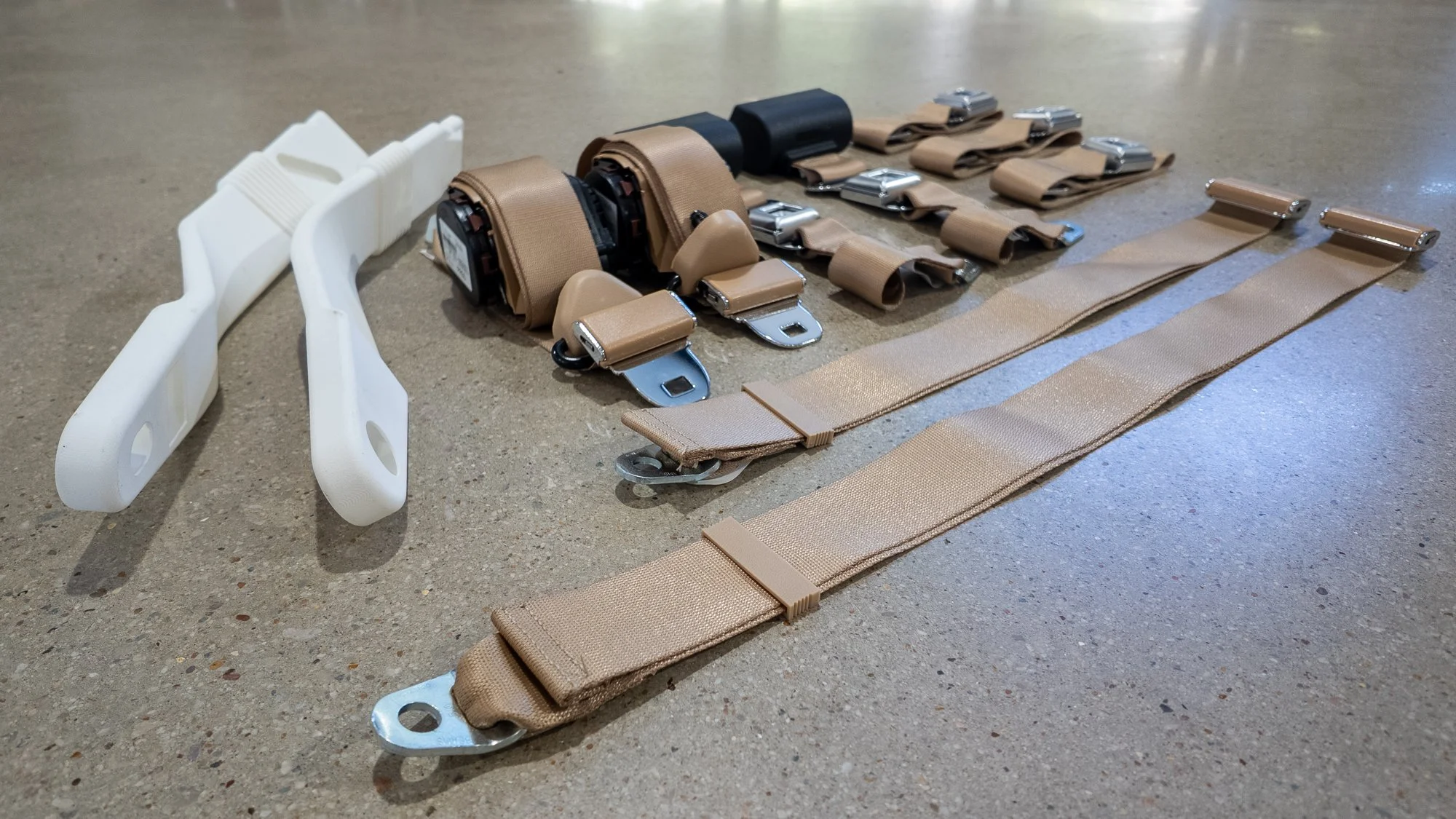 Close-up of Jeep Heritage seat belt retractor and buckle – FMVSS-certified custom fit for classic Jeeps
