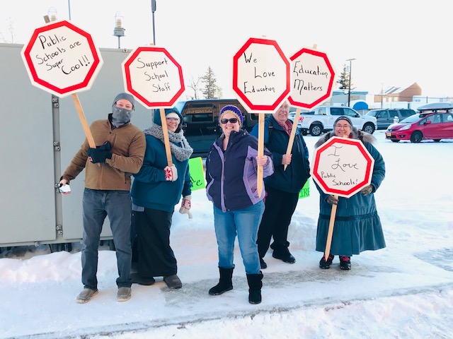 Members show their support for Education outside of the administration center on 5th avenue.