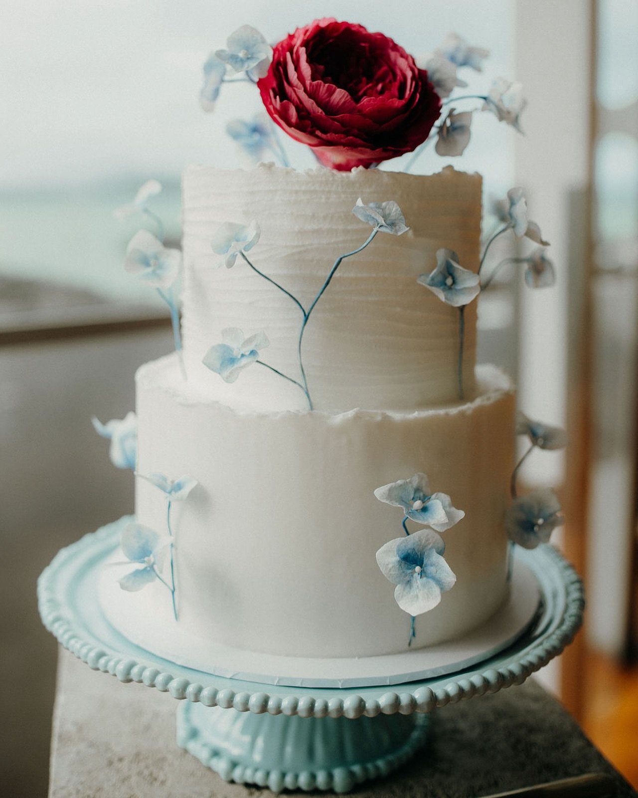 LOVE // A delicious wedding cake featuring delicate sugar art florals for a romantic modern wedding. 💙 Check out this gorgeous &lsquo;Echoes of Passion&rsquo; wedding styled shoot on our website now to see all the inspiring ideas and the talented ve
