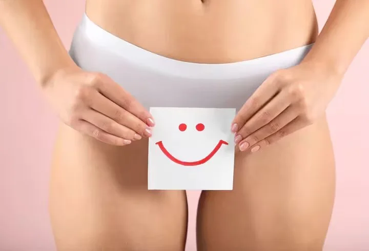 Tazi-young-woman-holding-paper-with-drawn-happy-emotion-gynecology-concept_124b2e89-f387-4a3d-8db0-08755c91ffed_converted.jpg