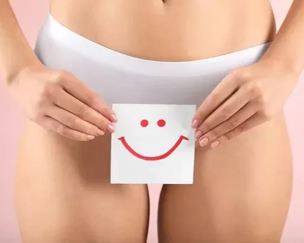 Tazi-young-woman-holding-paper-with-drawn-happy-emotion-gynecology-concept_124b2e89-f387-4a3d-8db0-08755c91ffed_converted.jpg