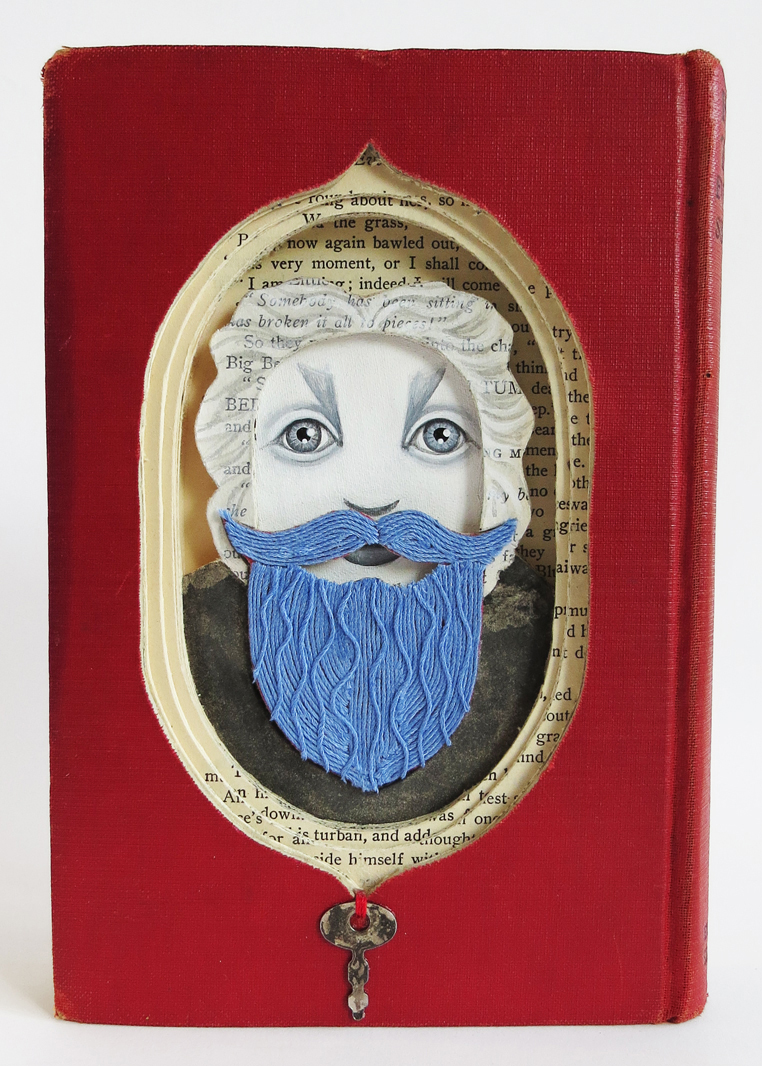 “What Doth Hide Behind That Blue Beard?,” Valerie Savarie, altered book, string, acrylic, 7-1/2”h x 5-1/4”w, $300 ($150 from the sale of this work goes to Lighthouse’ the remainder goes to the artist)