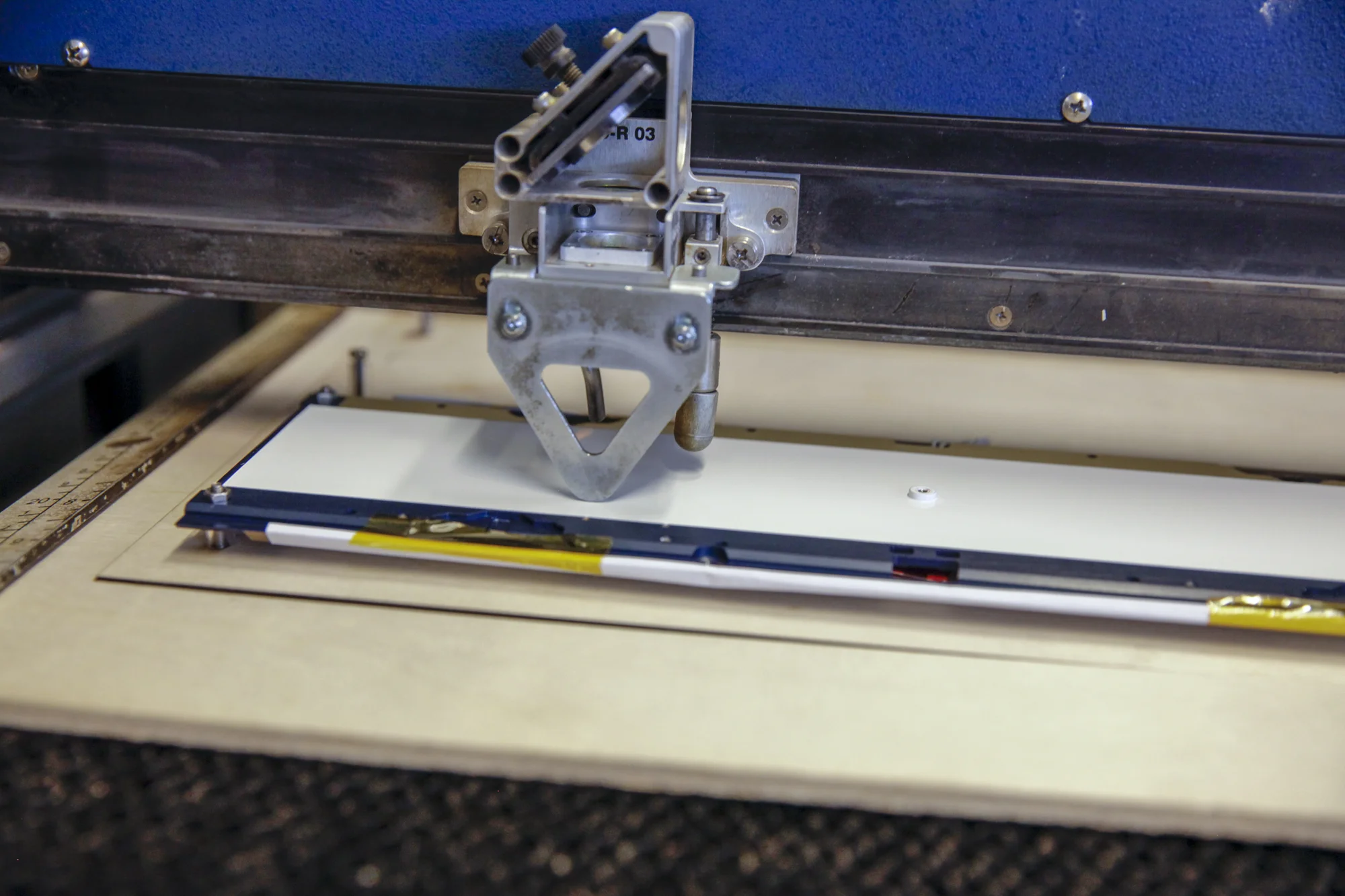 satellite panel in custom jig to level and stabilize the light weight aluminum in the laser cutting machine.