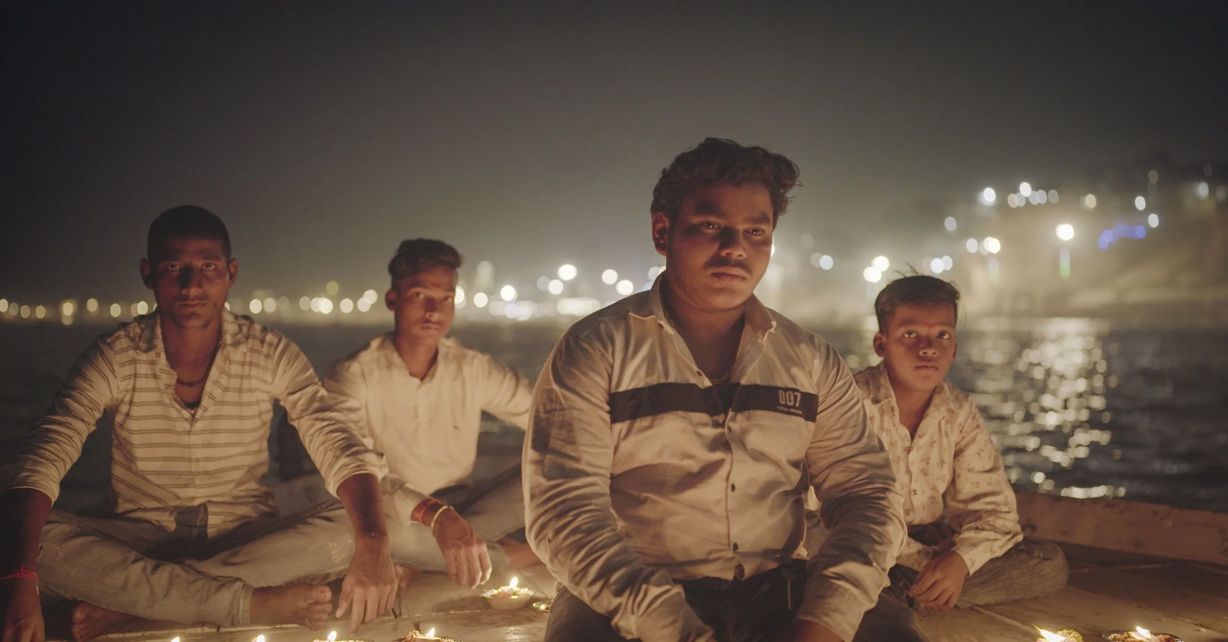 Om on the boat offering candle.jpg