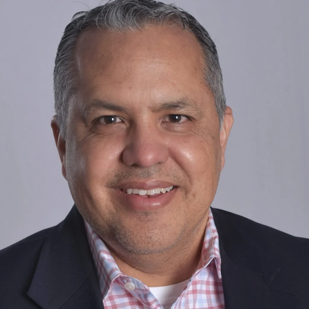 Portrait of Gabriel Lomas, Ph.D., counseling professor and forensic advocacy expert specializing in trauma, Deaf justice, integrated healthcare, and crisis intervention.