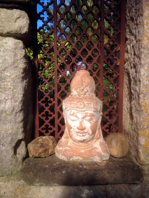 photo-of-terracotta-buddha-sculpture-in-garden-portland-dorset.jpg