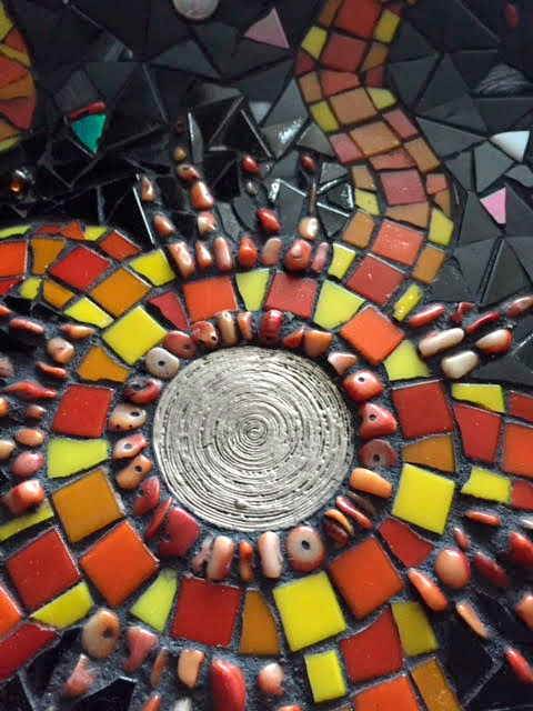 close-up-of-mosaic-sun-artwork-by-david-nicholls-portland-dorset.jpg
