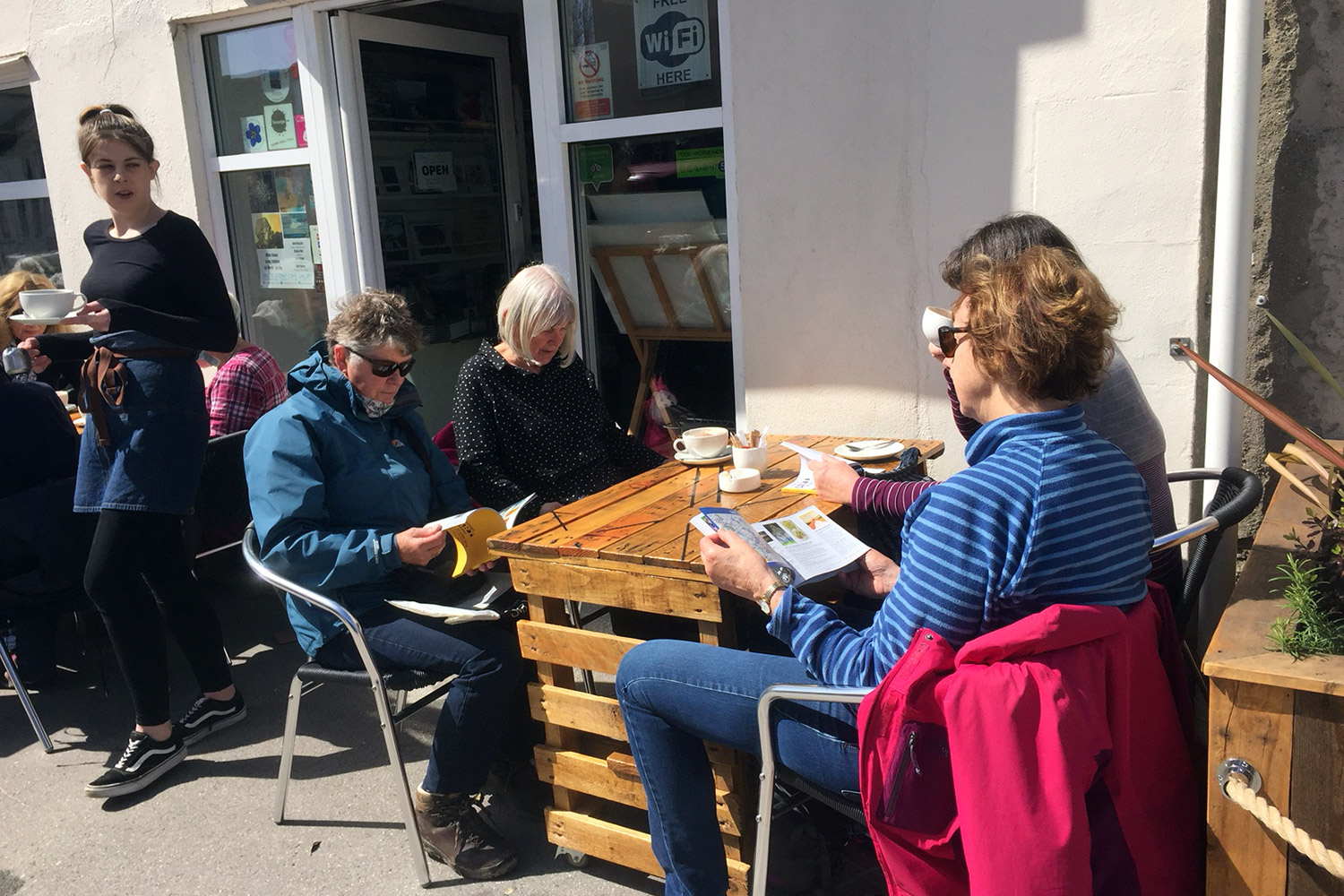 diners-and-waitress-outside-white-stones-art-cafe-gallery-portland-dorset.jpg