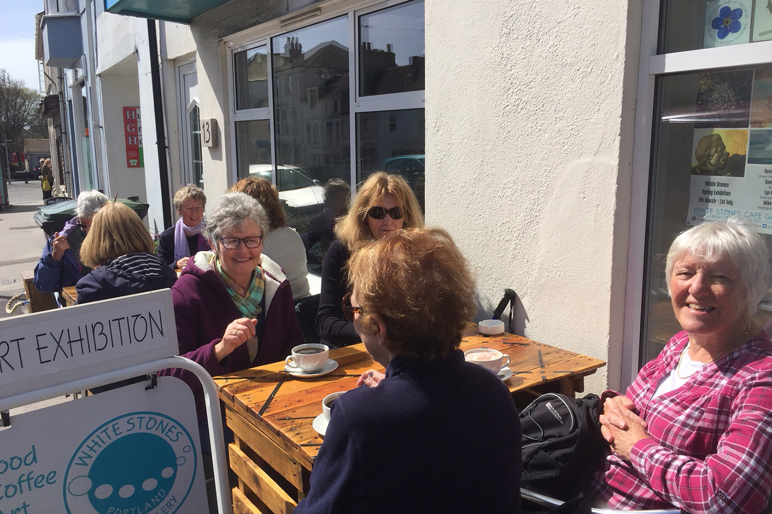 diners-chatting-and-eating-outside-white-stones-art-cafe-gallery-portland-dorset.jpg