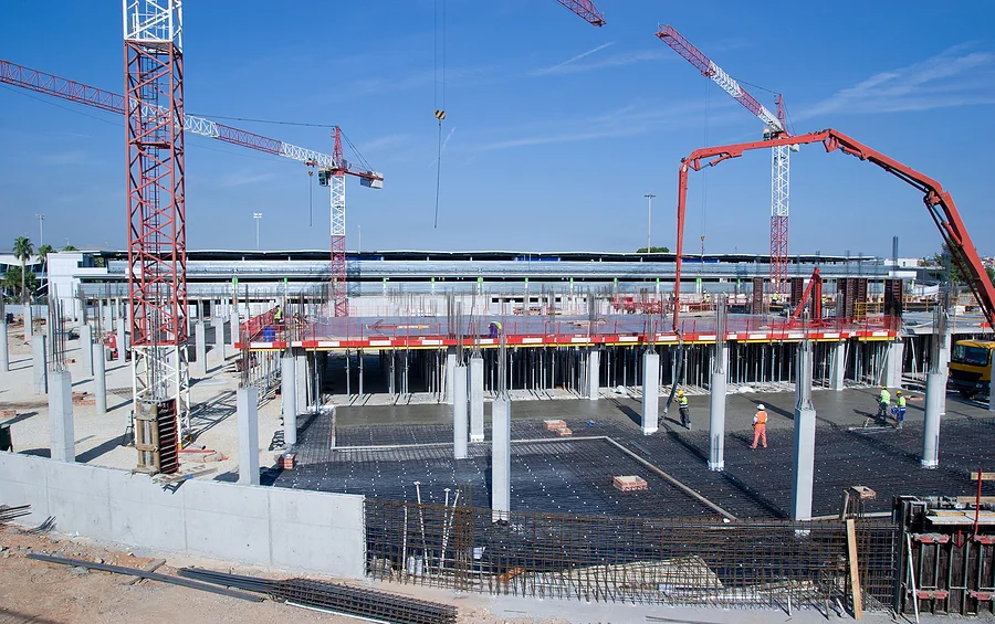 bigstock-Construction-Site-with-Cranes-18512663.jpg
