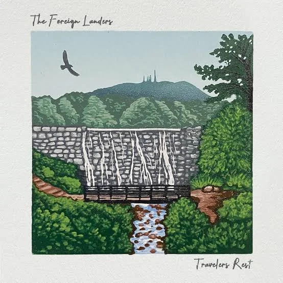 Illustration of a waterfall cascading over a stone dam surrounded by greenery, with a mountain and bird in the sky, titled 'The Foreign Landers' and 'Travelers Rest'.
