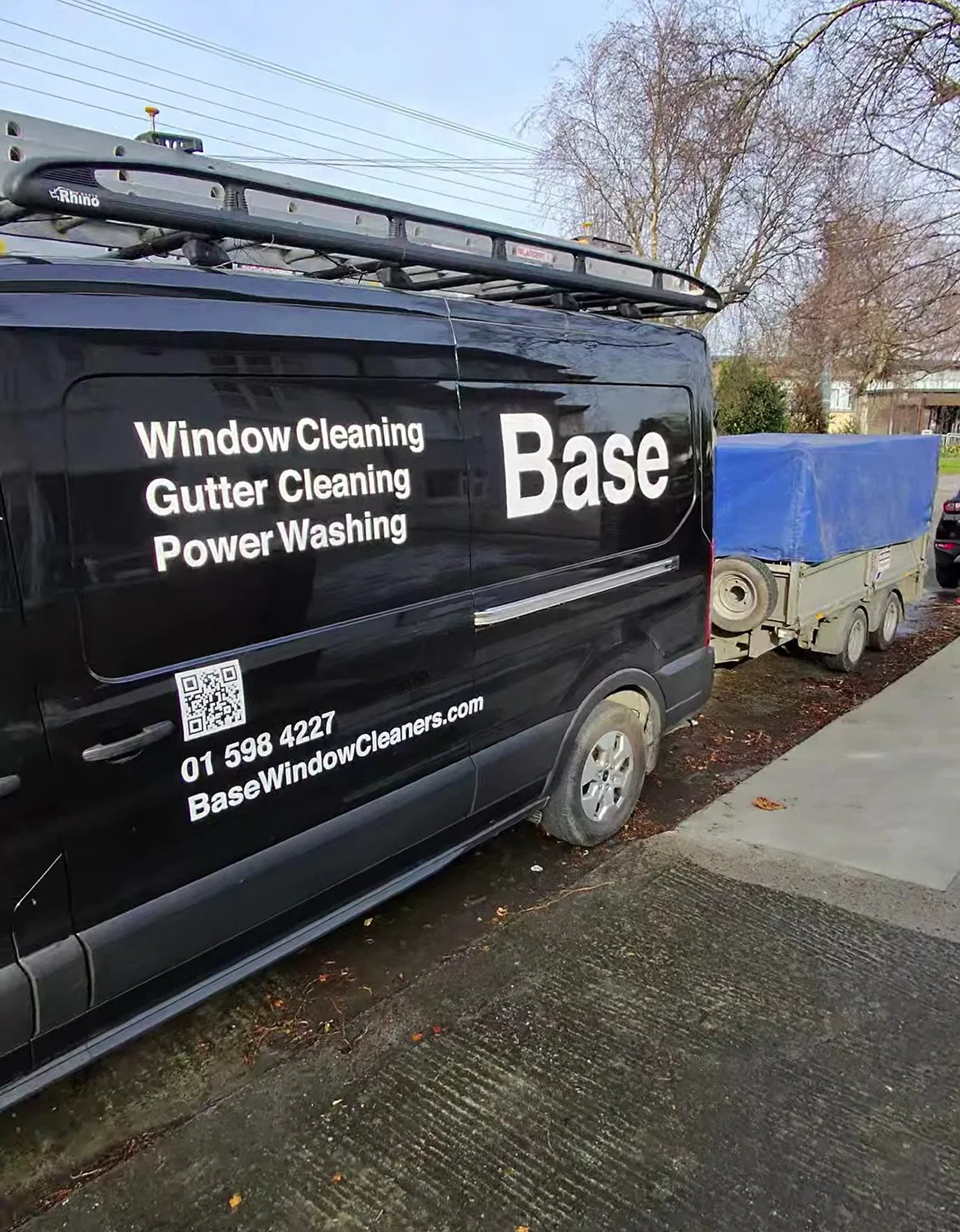 Base power washing van with dedicated equipment trailer at a Dublin property.