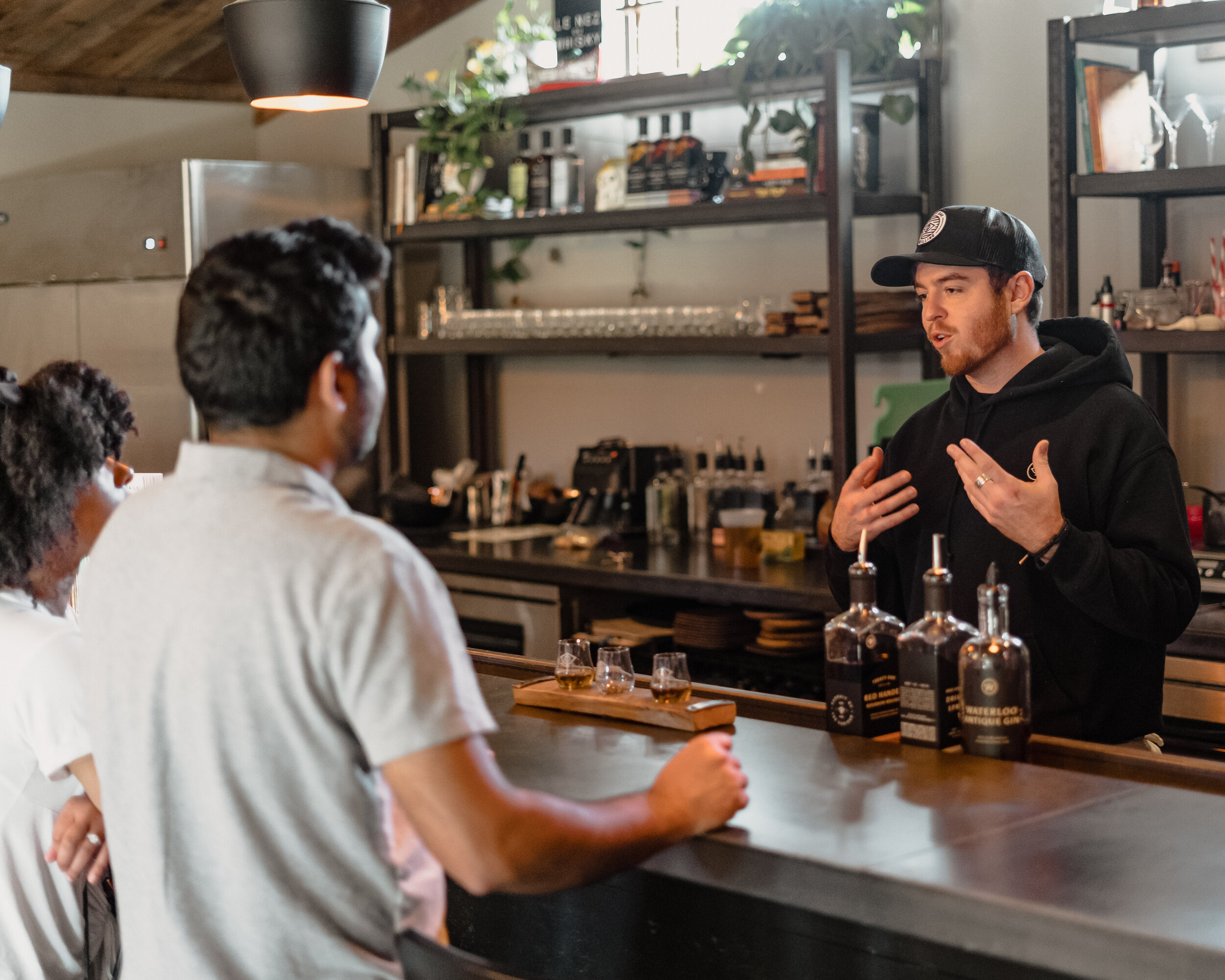 bartender speaking to customers