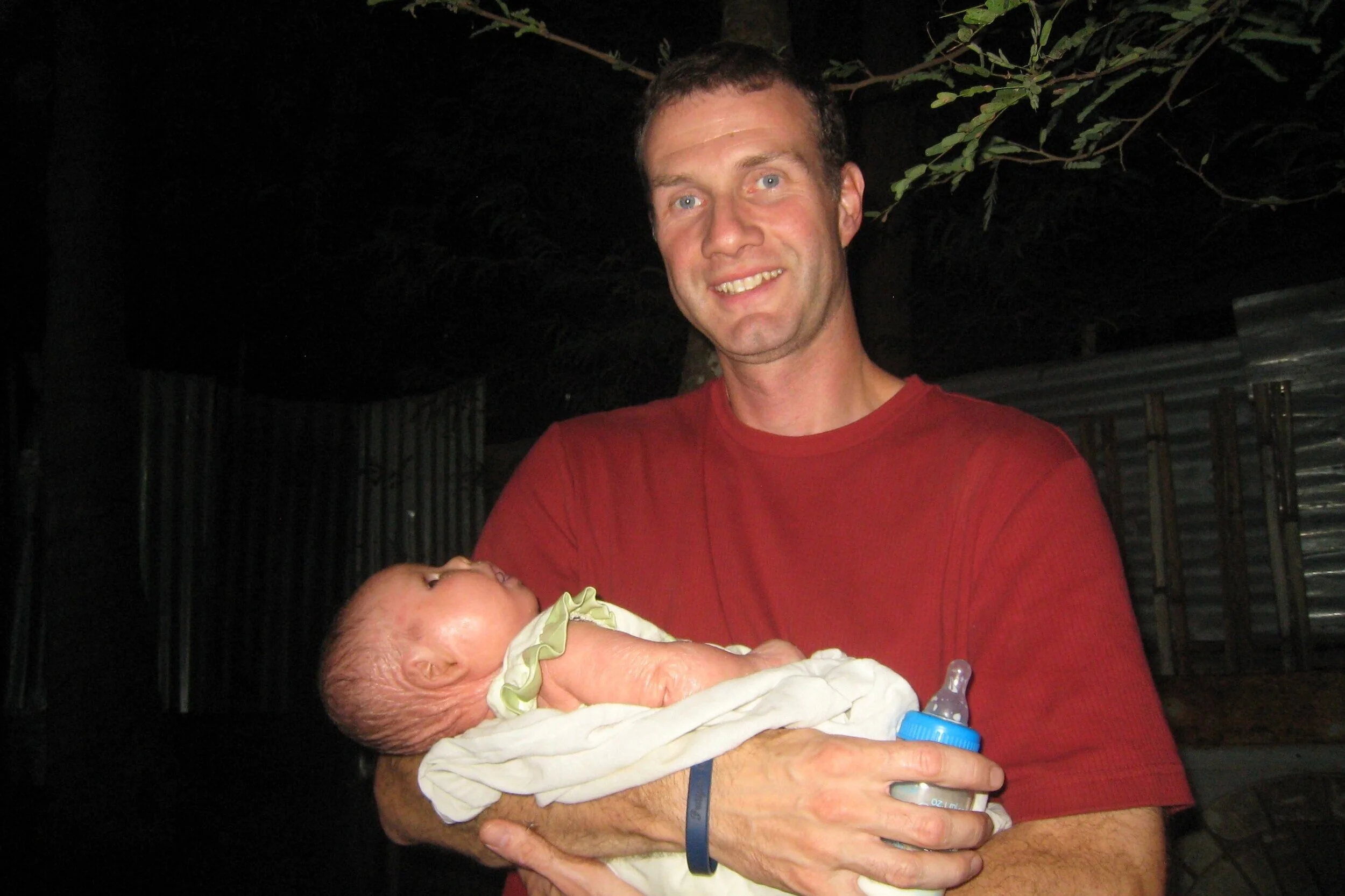 Our longtime volunteer, Adam Rogers, holding Su Su, months after she survived her time at the hospital. He is our #1 Aquaphor carrier! He’s been committed to this little girl since birth and has literally provided years of the life-saving cream for Su Su.