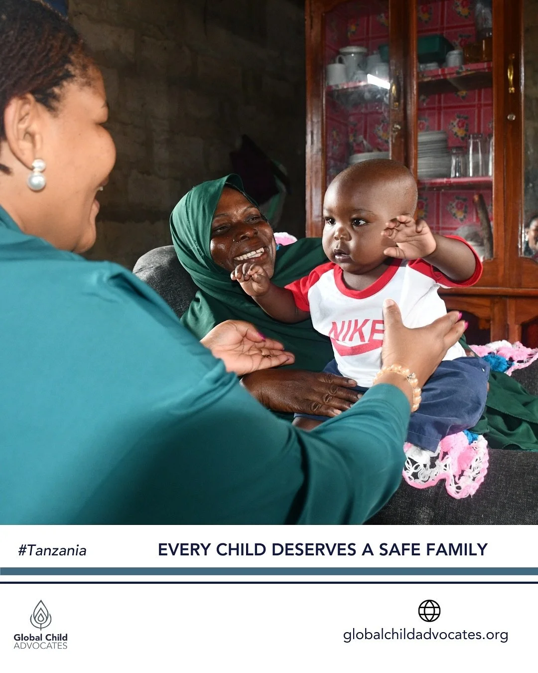 In this beautiful photo, a young boy stands at the heart of a story filled with love, courage, and collaboration. His foster parent and the dedicated Social Welfare Officer smile with pride as he takes the next big step, being lovingly reunited with