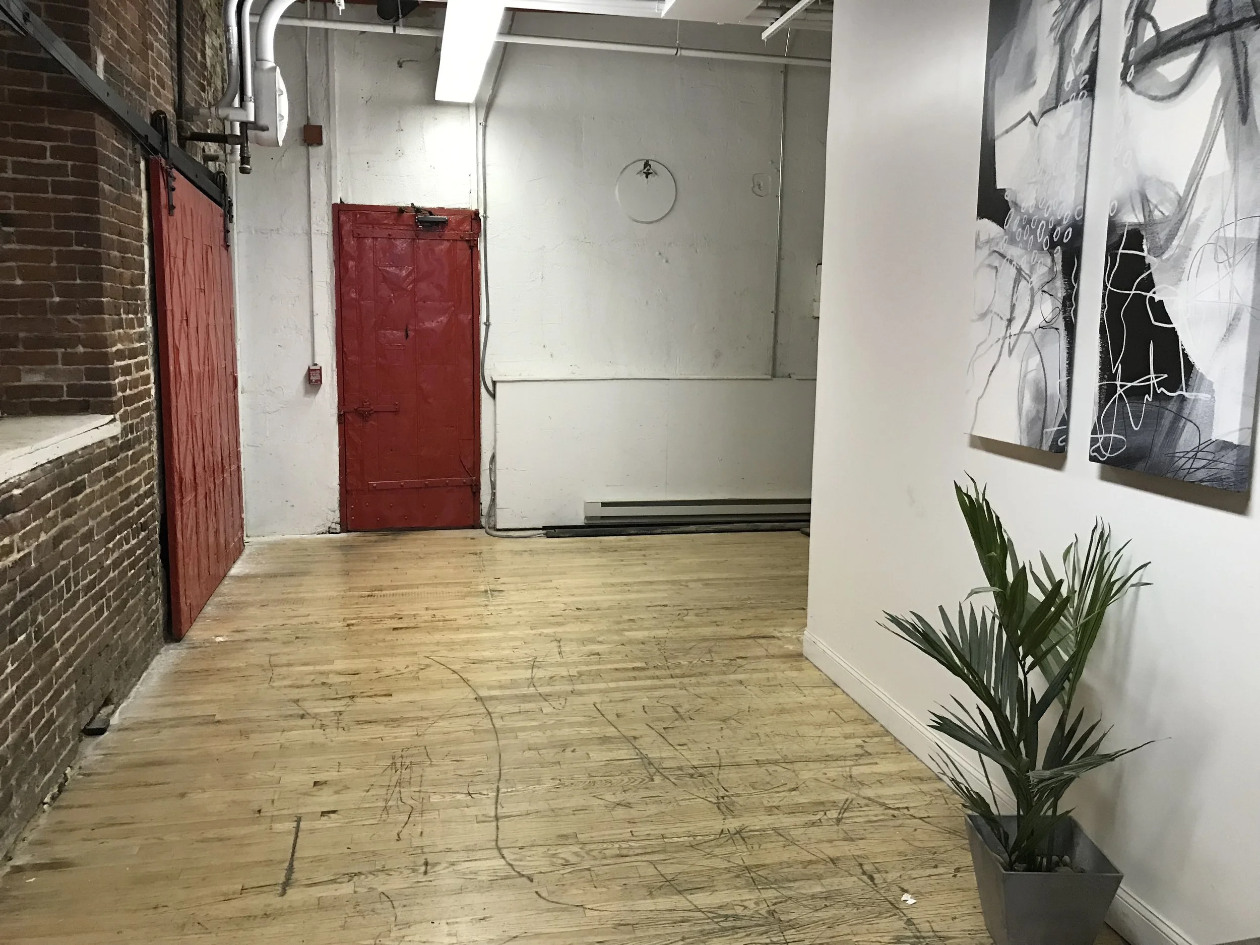 Go through red door on back wall and take stairs.