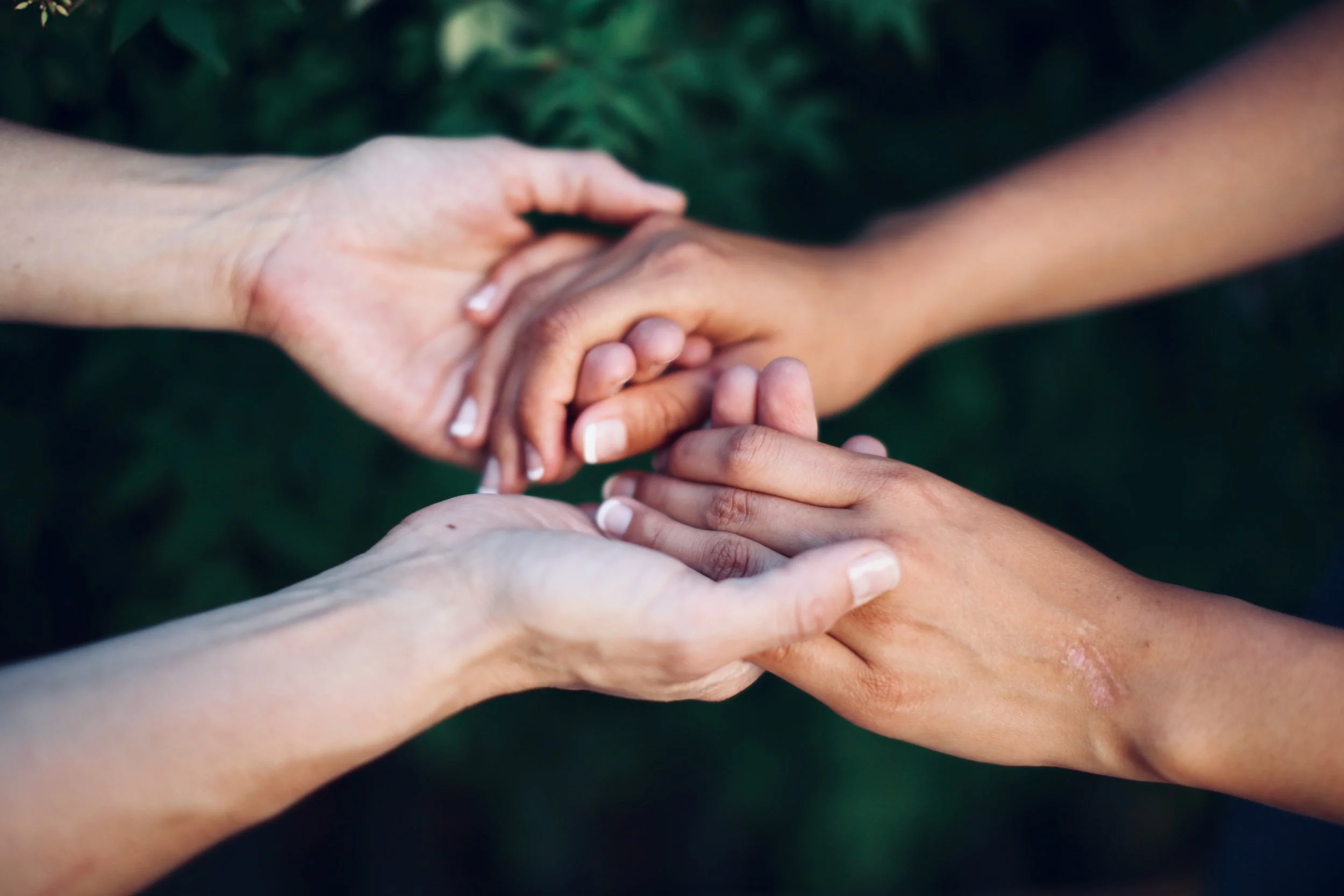 Healer's hands gently supporting another's.jpeg