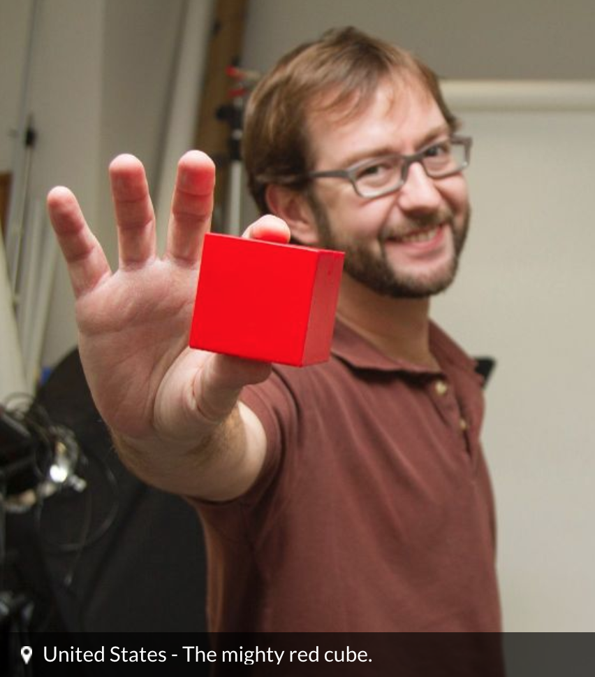 Red Cube Proud employee with his ‘cube’